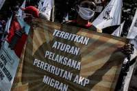 Ilustrasi aksi buruh menentang perlindungan pekerja migran.